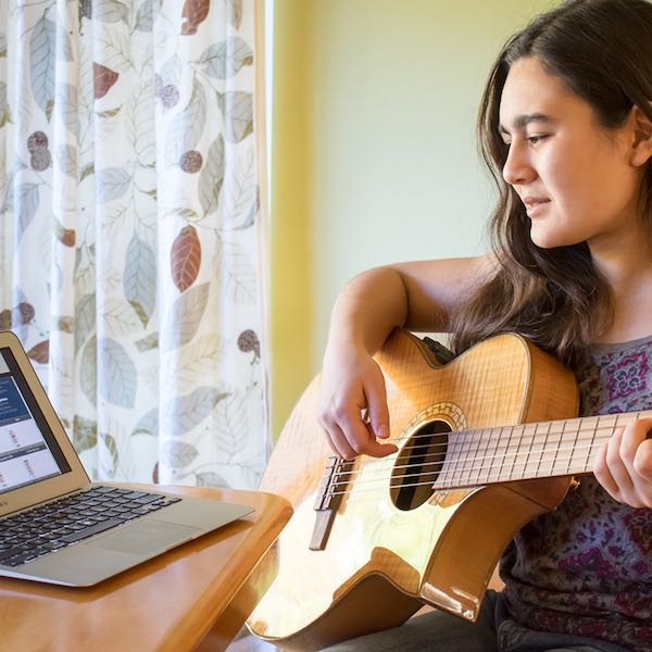 Why A Blog? (First post!) Woman playing guitar with TuneLing