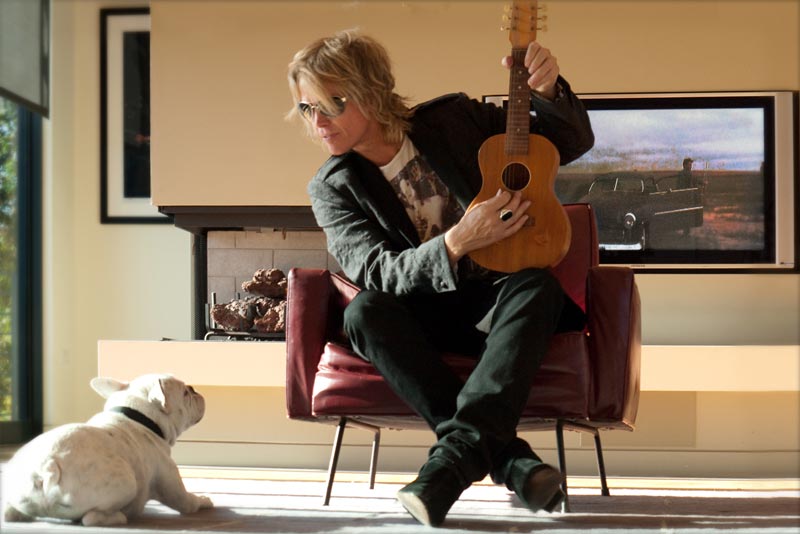 Brian Ray with ukulele and dog